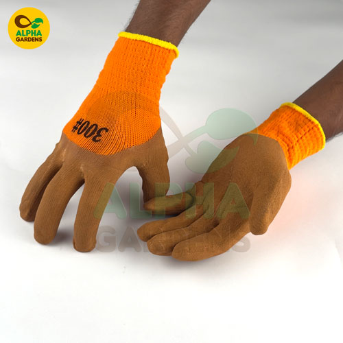 brown-gardening-gloves-with-orange-cuffs-worn-by-a-person