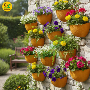 Vibrant flower baskets hanging on a stone wall with a garden setting.
