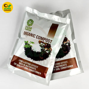 Two packages of Alpha Gardens Organic Compost on a white background